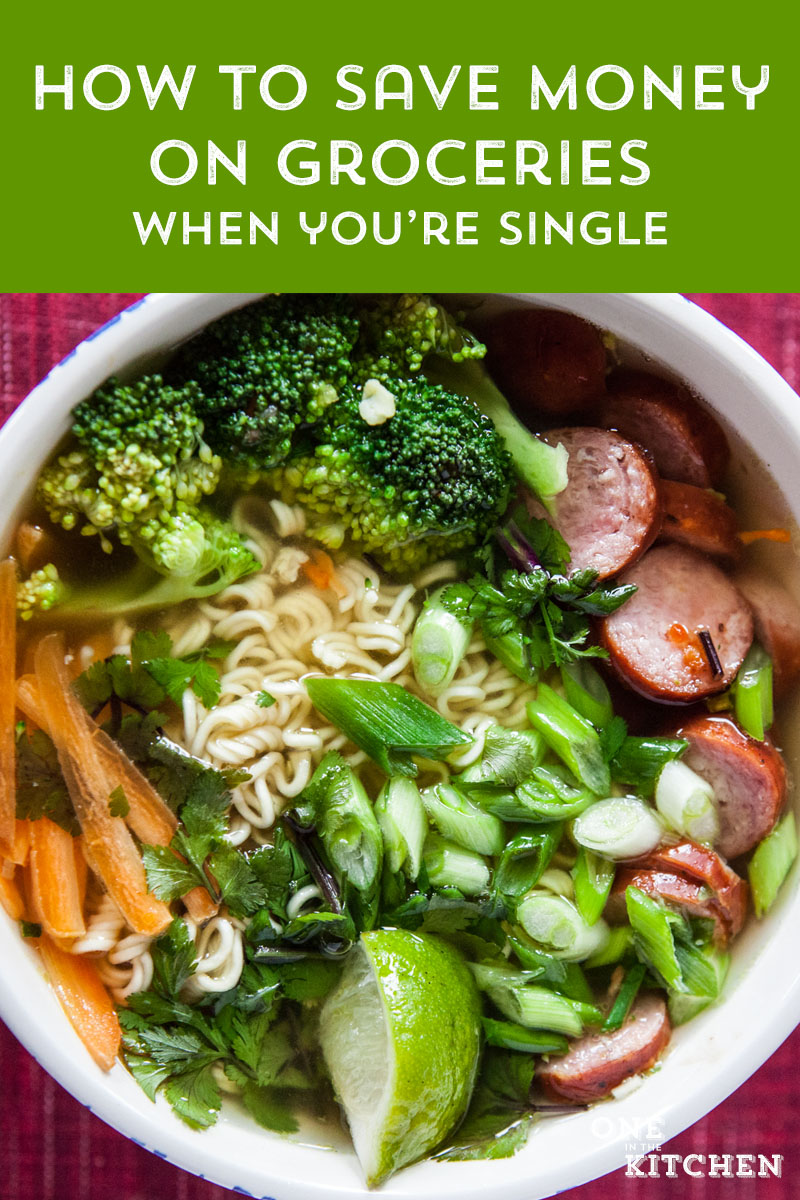 an overhead view of a bowl of ramen with a text overlay reading: how to save money on groceries when you're single